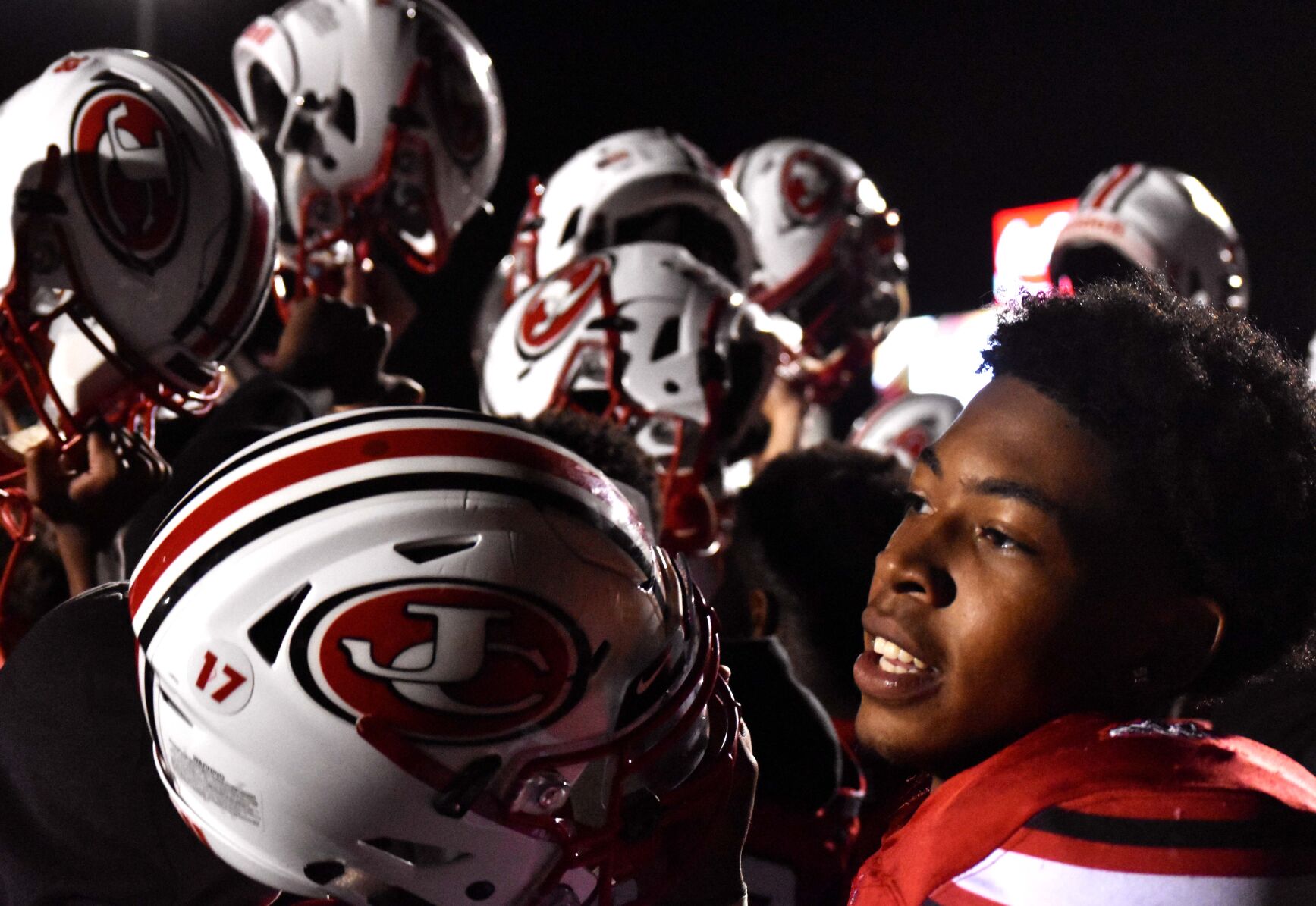 Jefferson City senior Steveon Dove celebrates a win with his teammates